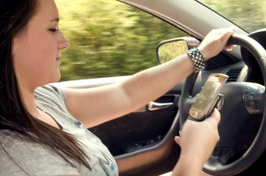 15865-a-teen-girl-texting-while-driving-pv